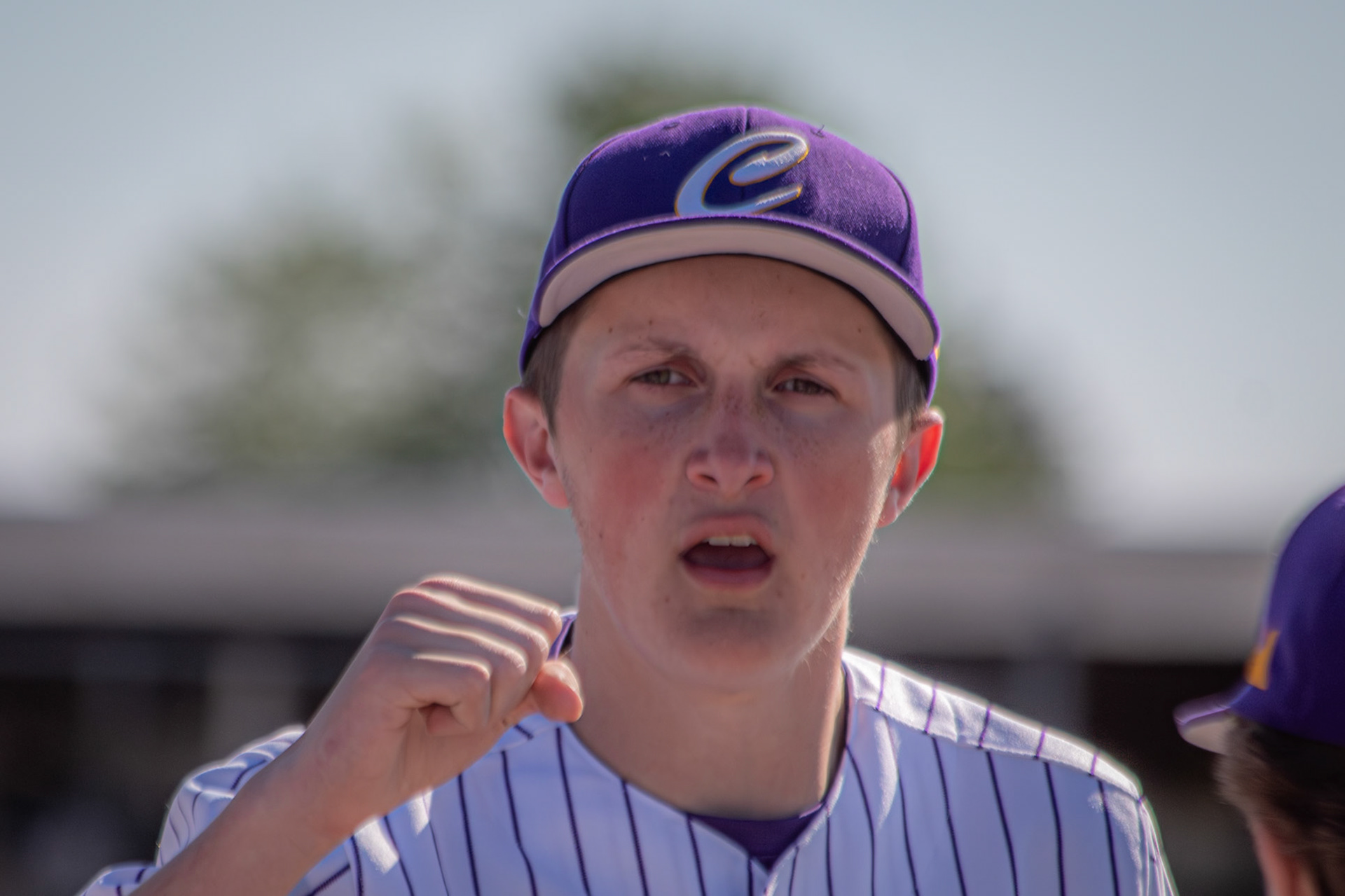 Freshman Brody Linker raises his fist as the team yells its chant before the game. (Photo by Elsha Bytwork)