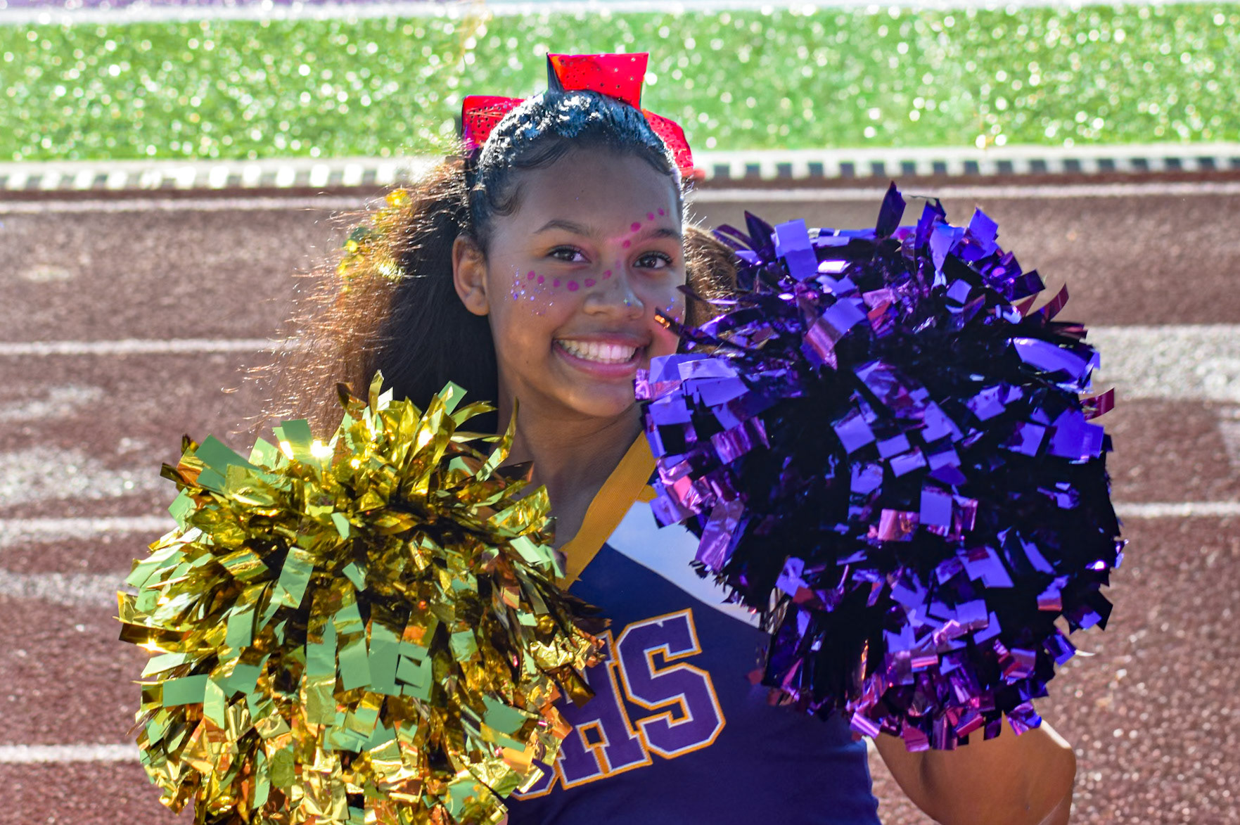 VARSITY VIBES  Tristynn Bisson brings varsity-level energy to the sideline as a standout sophomore. (Photo by Ollie Fox)