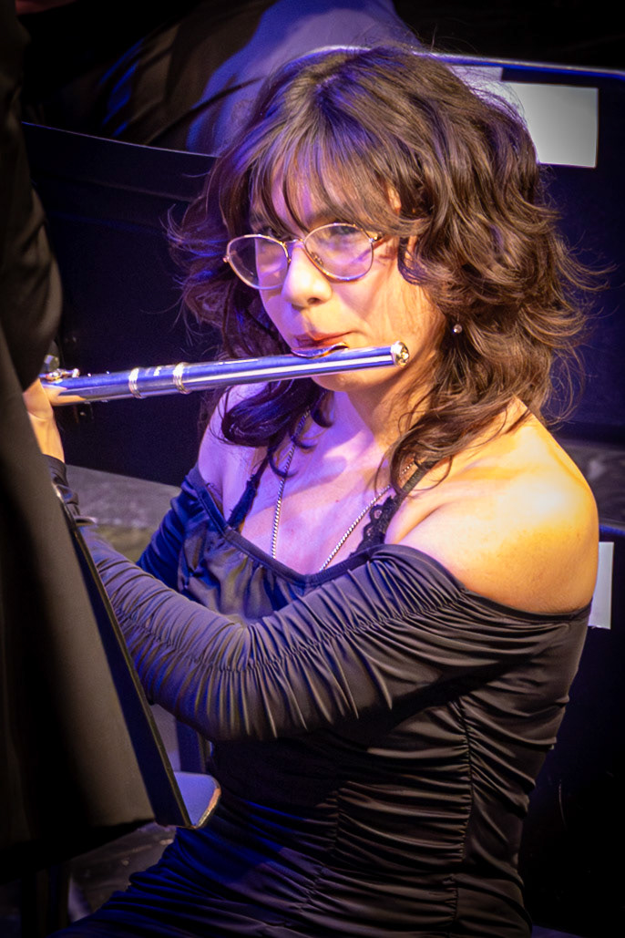 Stephanie Juarez watches the conductor closely, ensuring she stays in time with the ensemble. (Photo by Mackenzie Popma)