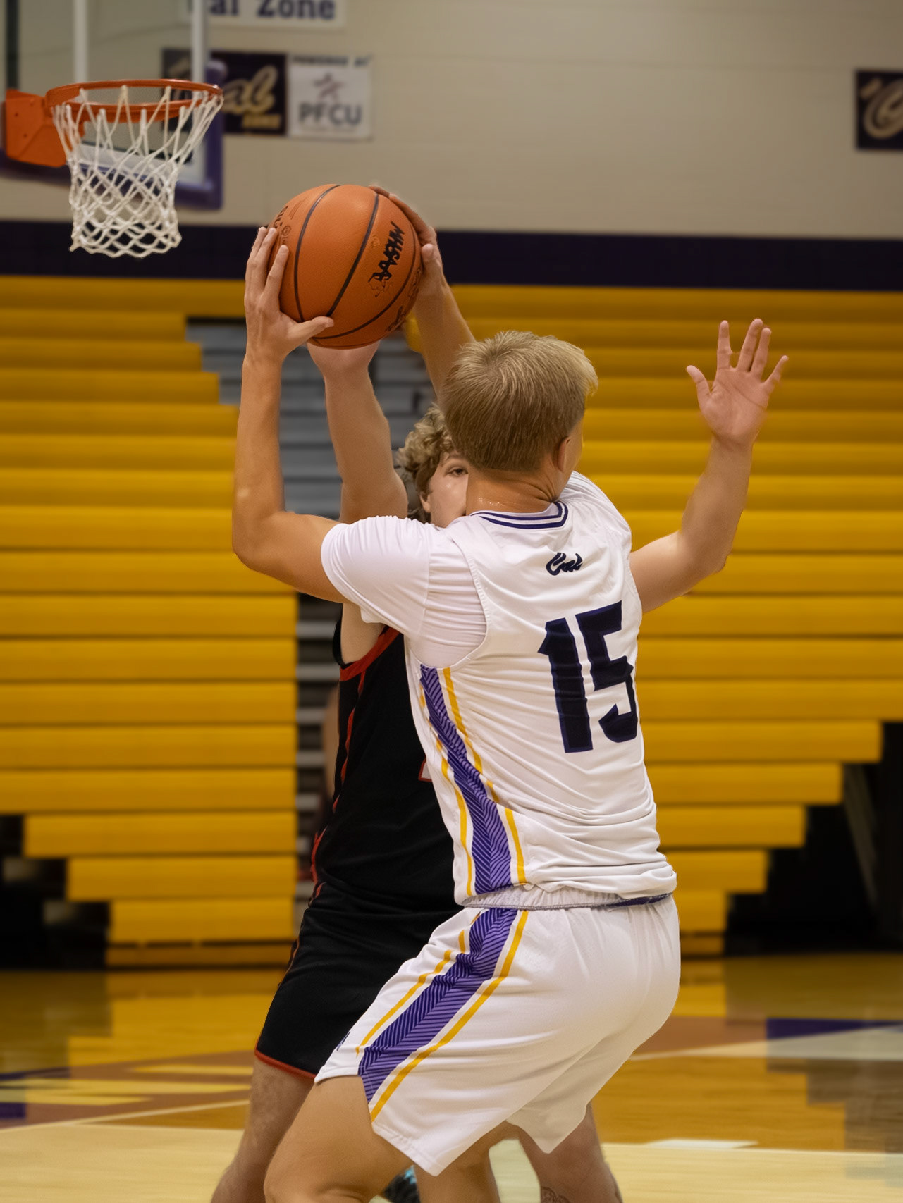 Bryce Backus loads up to pass the ball to teammate Lincoln Senti, who then shoots and scores. (Photo by Khloe Lowande)