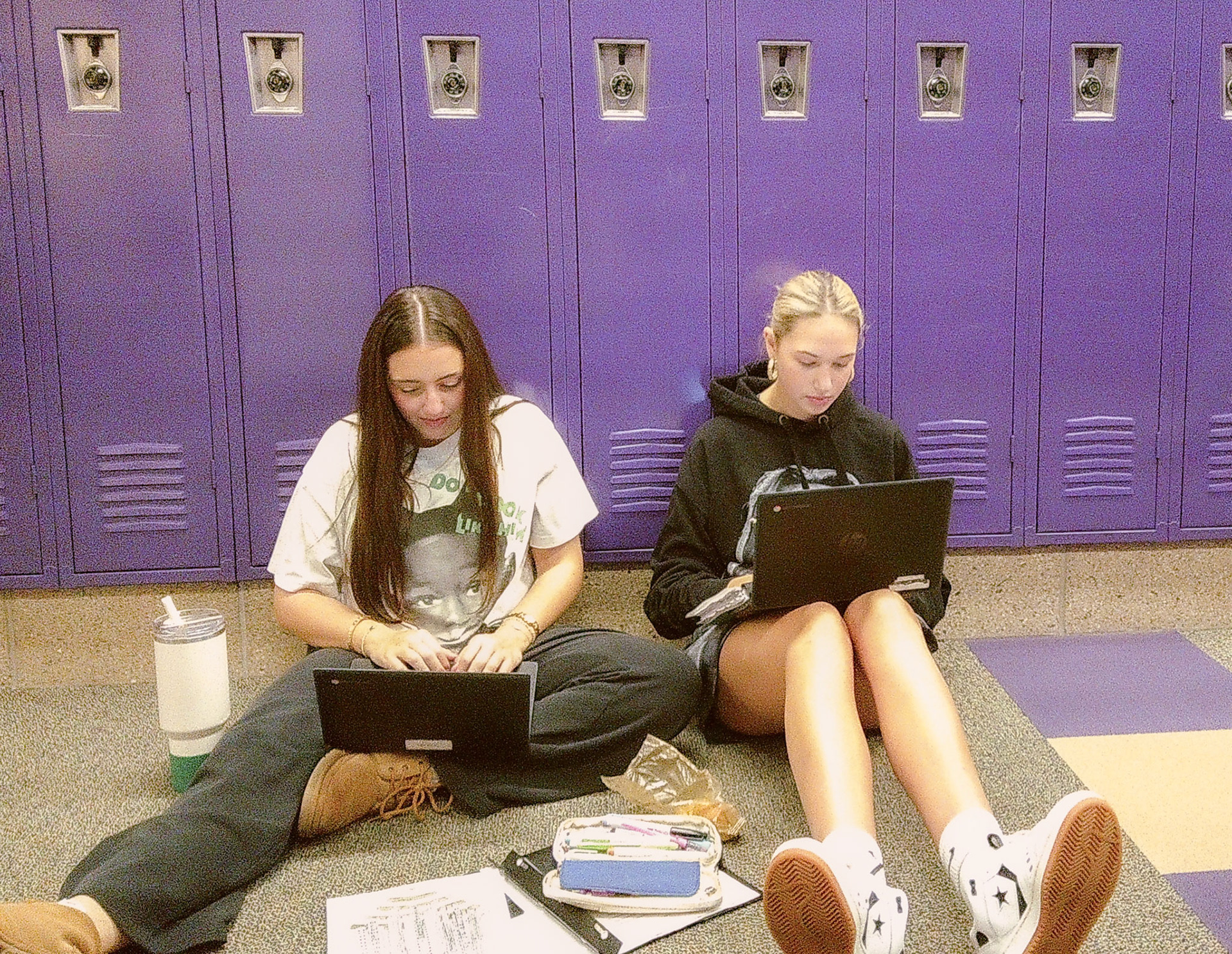 Kyla Charles and Gillian Guzman work hard to get their writing and land drawing done by the end of the hour. (Photo by Gillian Guzman)