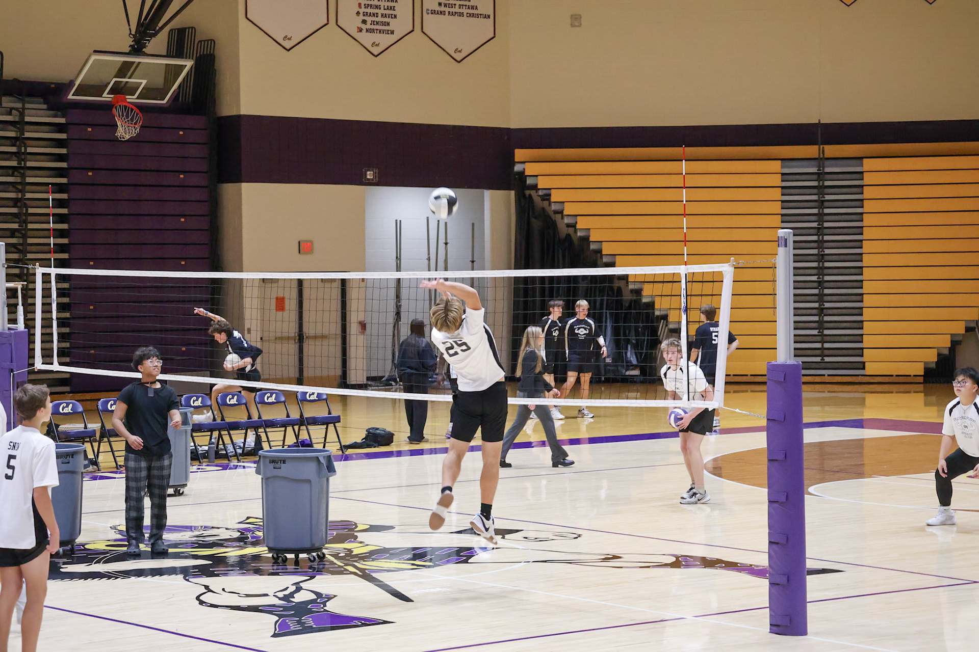 Isaac Judd flys up for the pratice spike warming up for the Flower Fluff game against the seniors. (Photo by Abigail Tava)