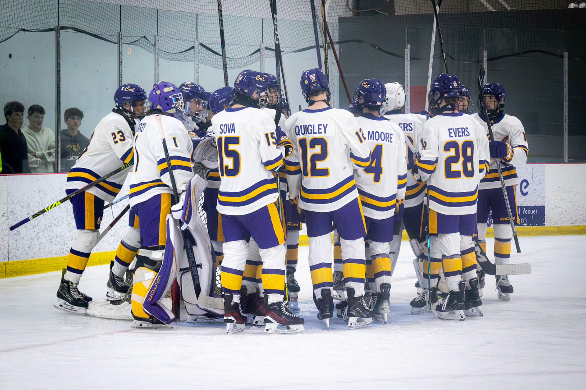 The team huddles up before the game to discuss how they can pull out the win against Big Rapids.(Photo by Molly Muller)
