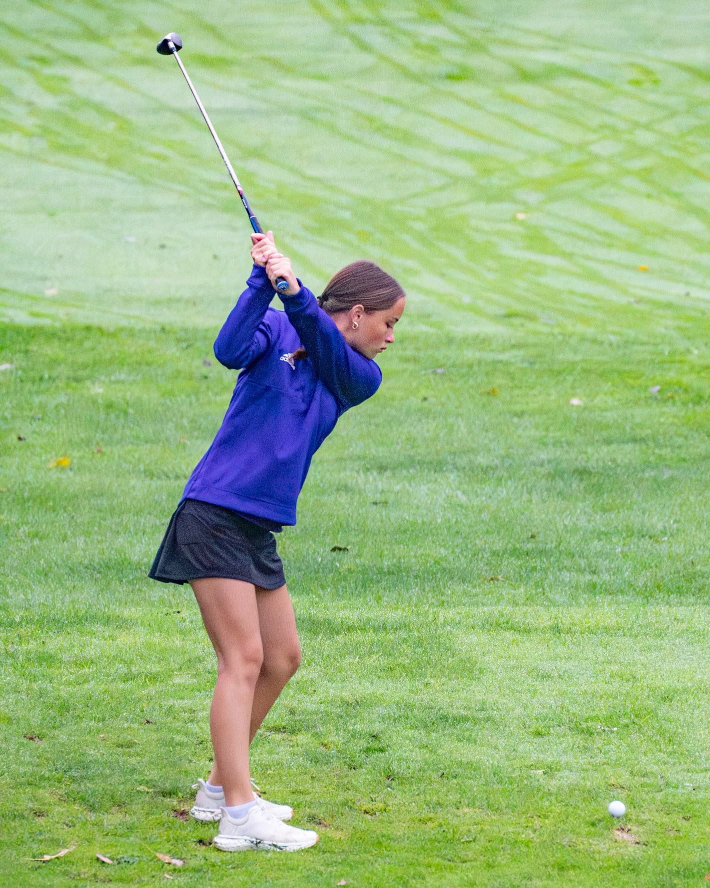 Katie Honhart prepares to swing her club from the rough. (Photo by Jolie King)