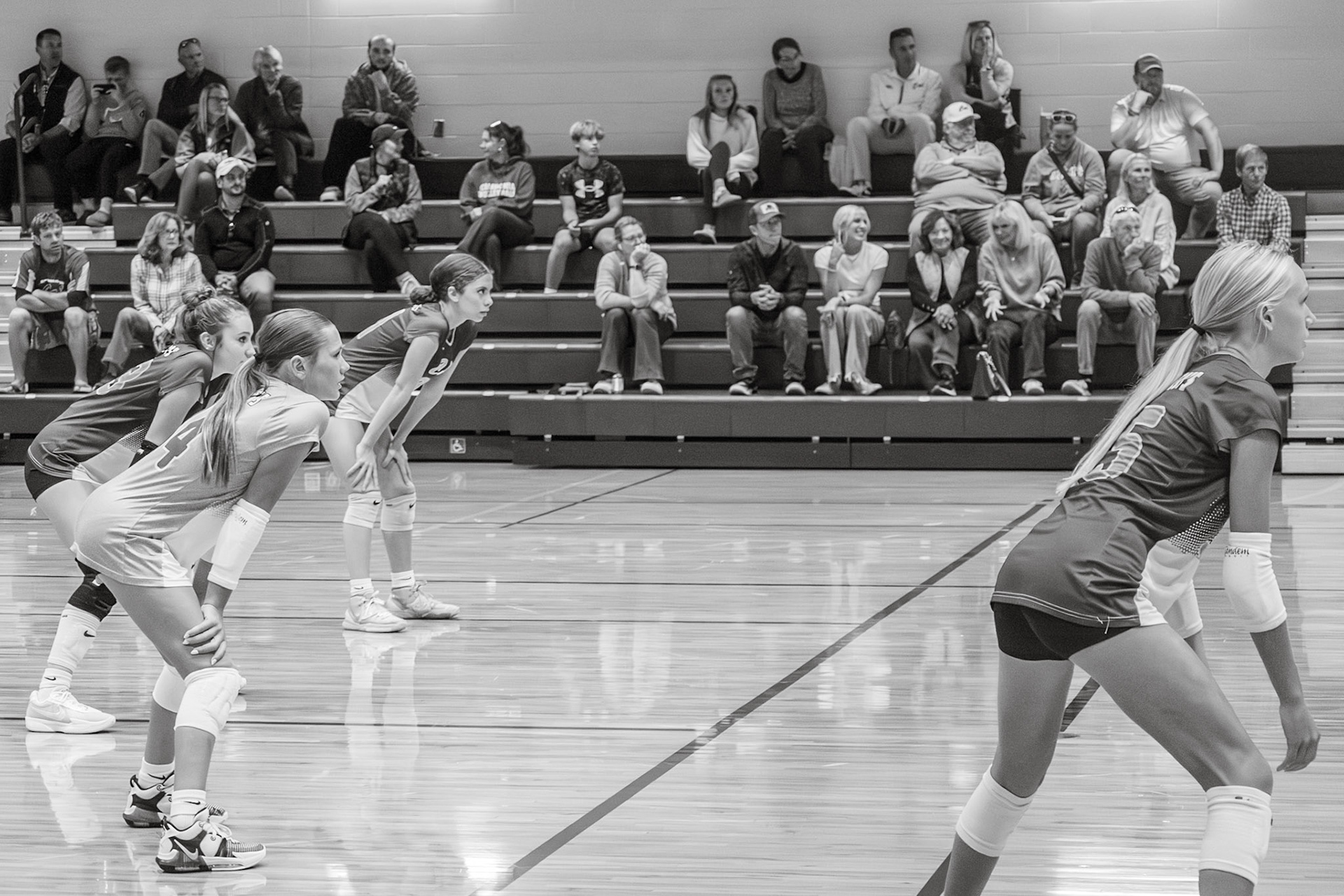 Sophia Blaser, Grace Boshnyak, and Maci Warburton focus intently, waiting for the next play and ready to score. (Photo by Aslyn Crocker)