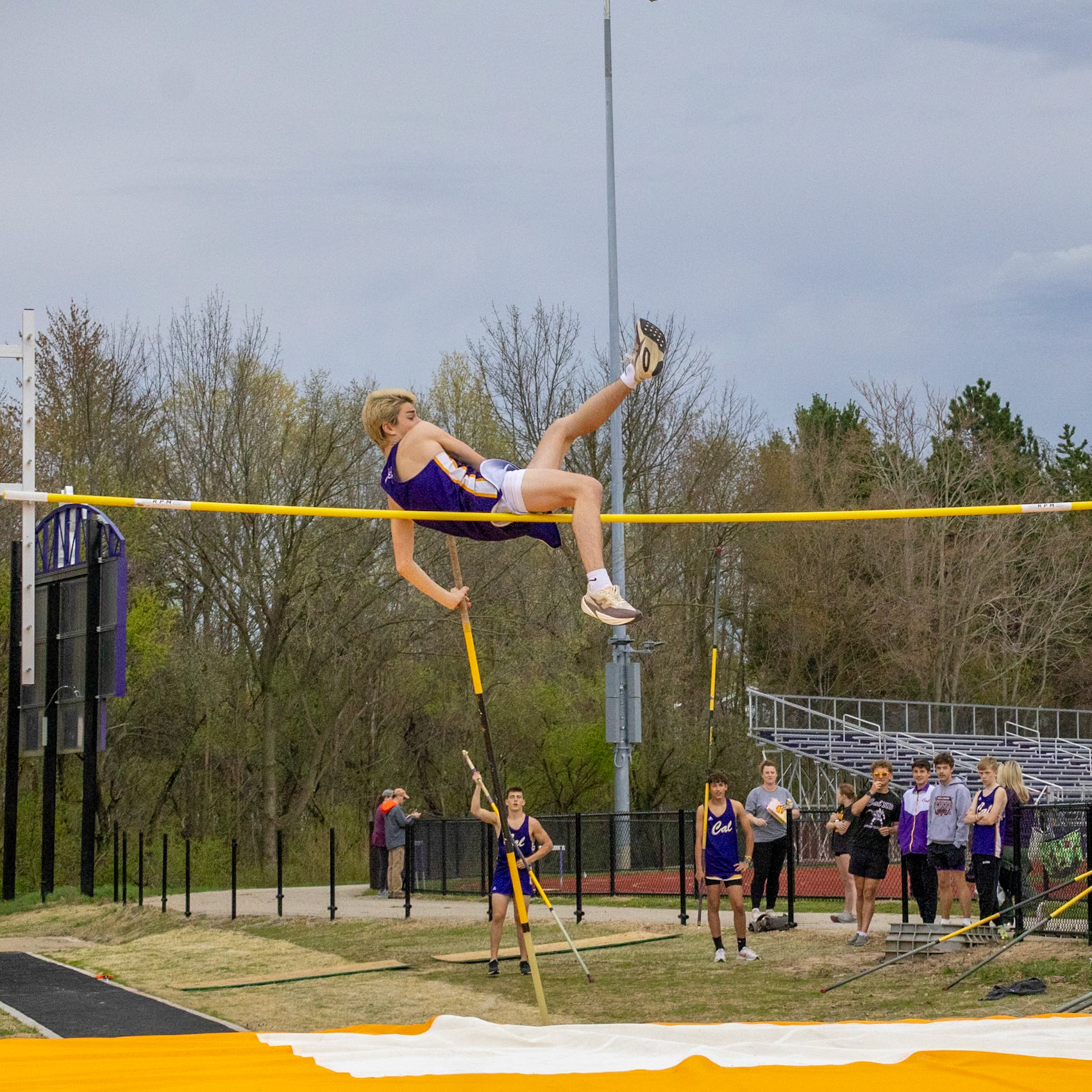 Seth Miller vault himself over but barely nudges the bar and his jump is scratched. (Photo by Justin Harper)
