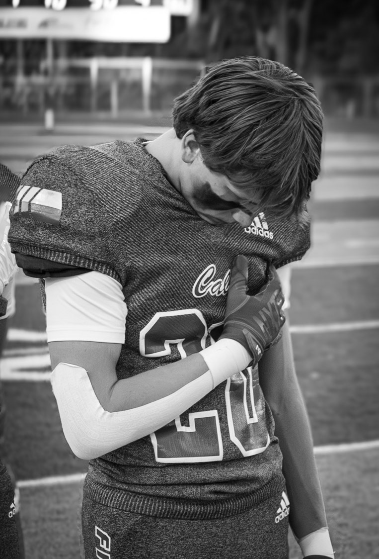Paxton Stalsenburg in a moment of stillness, preparing for an intense game against the Rockford Rams. (Photo by Khloe Lowande)