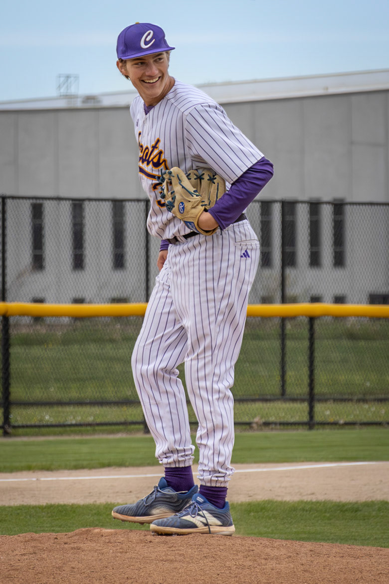 Junior Gavin Seabert shows a confident smile on the mound during the Scots’ matchup against Muskegon. (Photo by Vivian Hoffman)