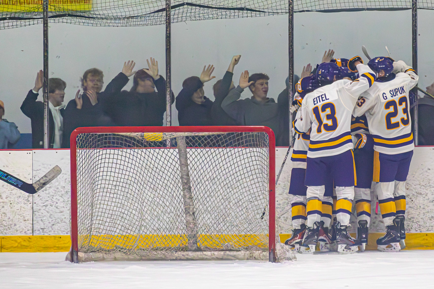 The boys celebrate after Senior Ty Lewandowski scored Cal's first goal of the game with an assist from Junior Drew Nichols. (Photo by Avarey Lippert)