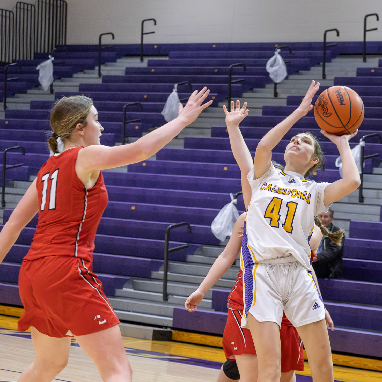 Madison Triebel drives to the basket and finishes strong through traffic. (Photo by Landry Mueller)