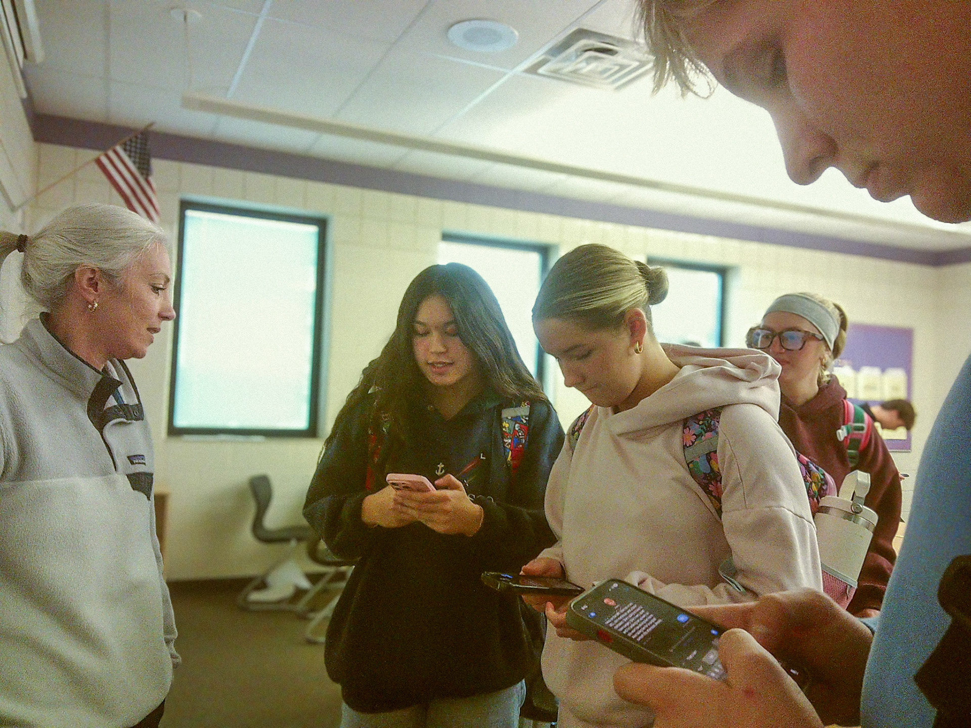 Following Statistics class with Ms. Wagner, seniors Ellie Tennant, Kortney Muller, and Jameson Palmer discuss their weekend plans. (Photo by Tana Coates)