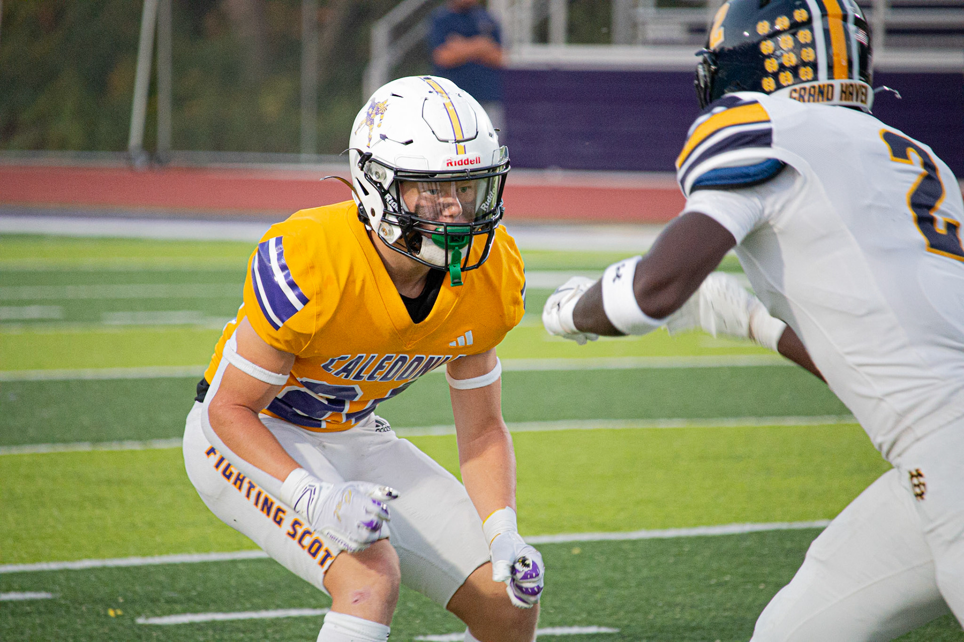 Caledonia's Cornerback Carter Berends locks in on his opponent during a tense early snap, reading the play and preparing to make a move. (Photo by Egan Otto)