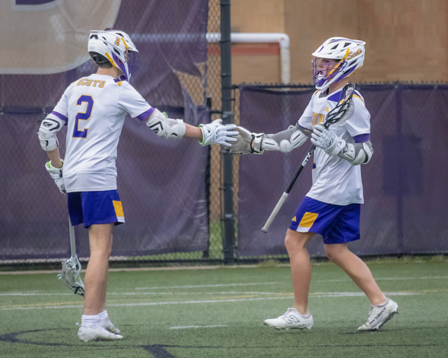 (40) After scoring his third goal of the night, Zach Fischer is congratulated by teammate Corbin Ryder for the hat trick. (Photo by Ella-Grace Wickens)