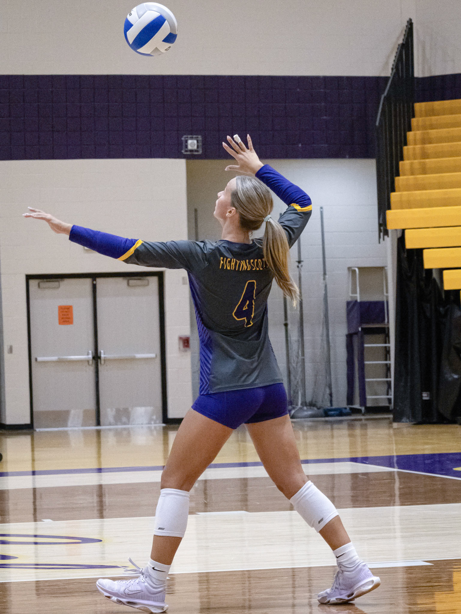 Junior Avery Seif serves the ball to the Byron Center bulldogs. (Photo by Tana Coates)
