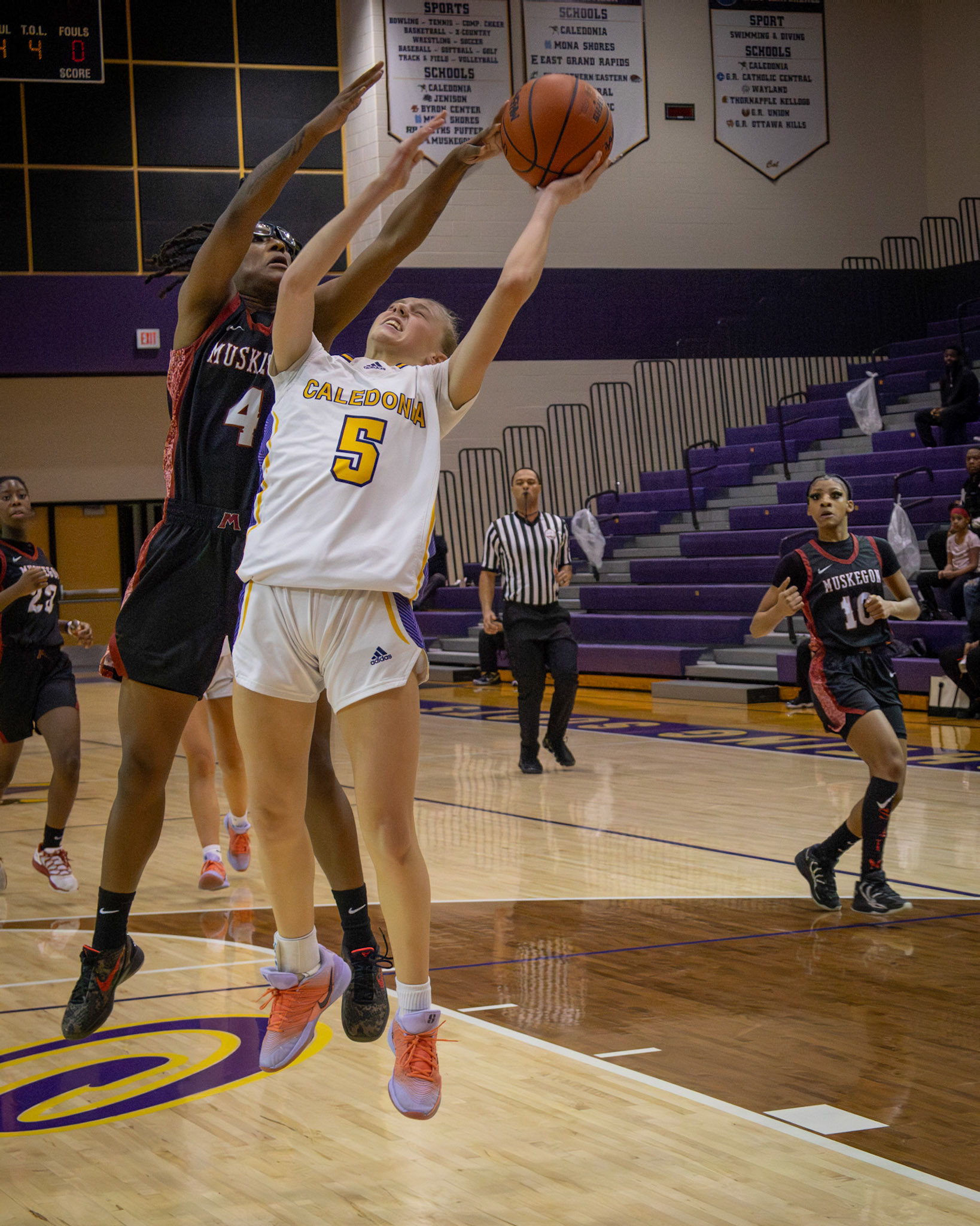 FREE THROW Competing at the varsity level, freshman Reese Abbott steps to the line for two free throws after a Muskegon foul. (Photo by Taya Penoes)