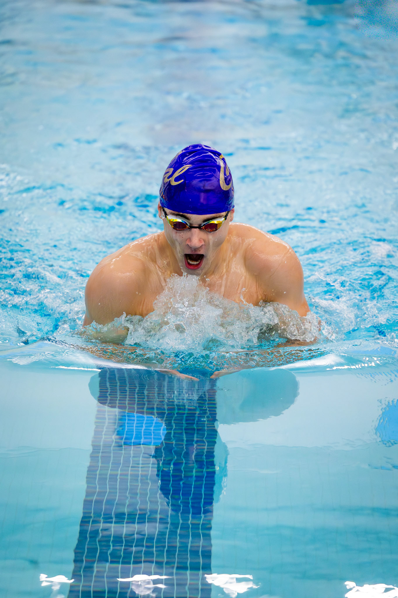 Ethan Snapper races the 100-yard breaststroke, maintaining control from start to finish. (Photo by Hailey Thayer)