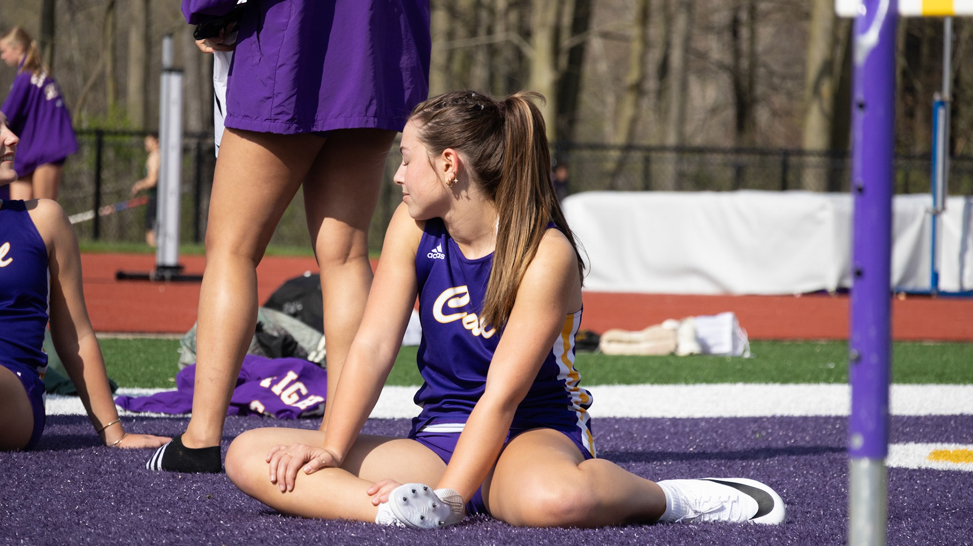 Aibree Akers bathes in the sunlight before a nice, sunny meet. (Photo by Emma Garza)