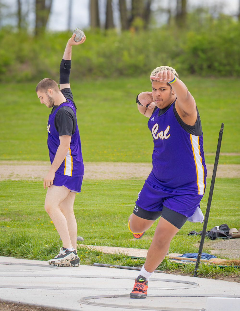 Isaiyah Supuk runs through the motions of a practice throw, fine-tuning his technique and rhythm before the real attempt. (Photo by Aibree Akers)