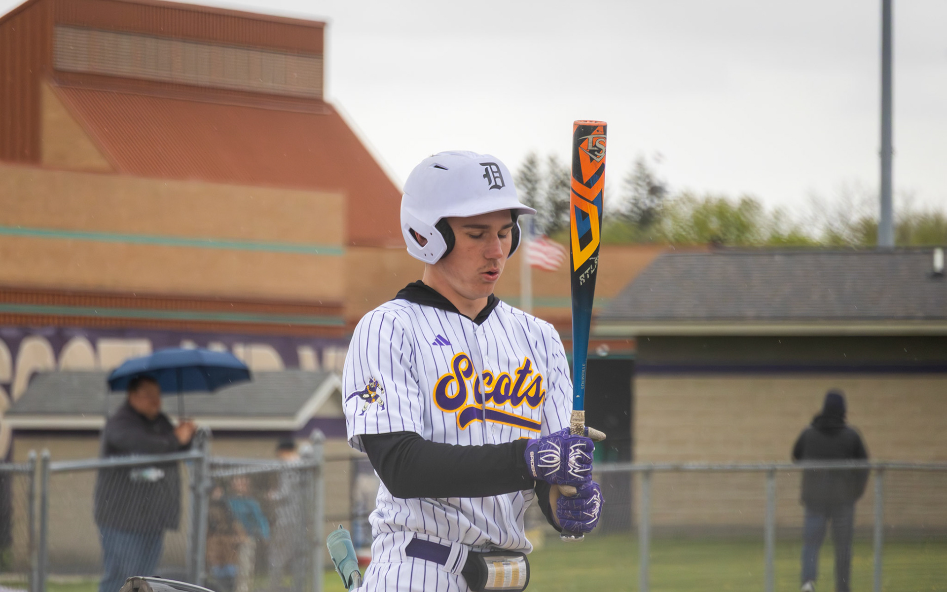Oliver Olmstead takes a breath while stepping up to the batter's box. (Photo by Emma Garza)