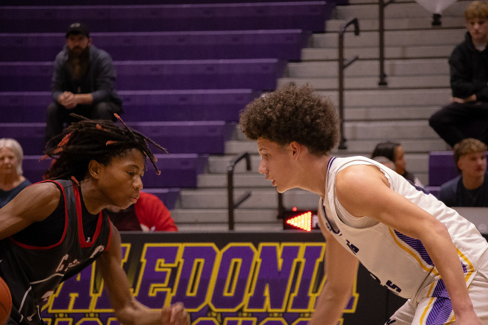 Levell Dunn squares up face-to-face with his opponent, locking in on defense as the ball stays in their hands. (Photo by Judah Dorband)