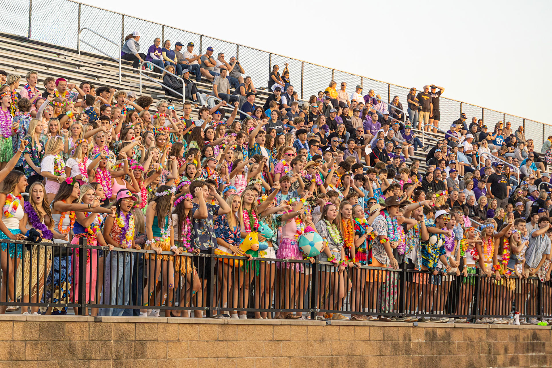 BOO HOO  The student section shows a rowdy thumbs down in response to a solid play by rival East Kentwood. (Photo by Abby Skibinski)
