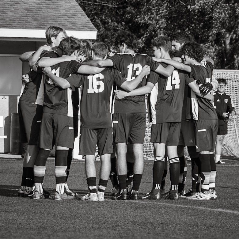 HUDDLE Before the game the team comes together to prepare for the game. (Photo by Brianne Weih)