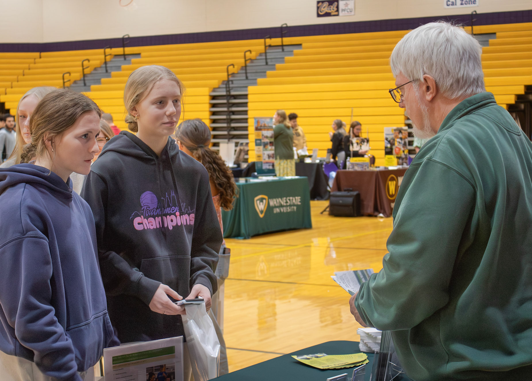 Reese Abbott and Breckyn Dixon learn about agricultural programs from a Michigan State representative. (Photo by Mya VanderZwaag)