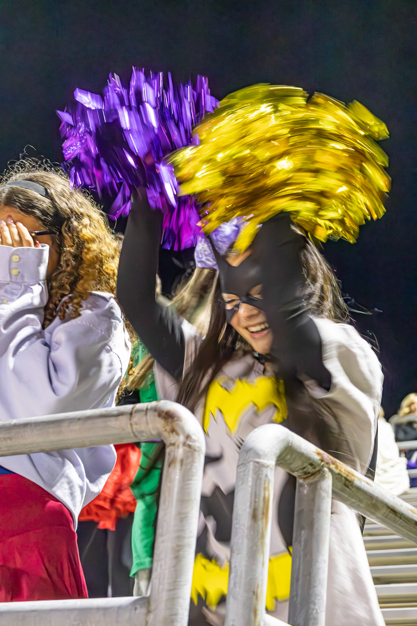 After waiting all night for the cheer team to start the “Go Bananas” chant, senior Emily Dark happily joins in. (Photo by Avarey Lippert)