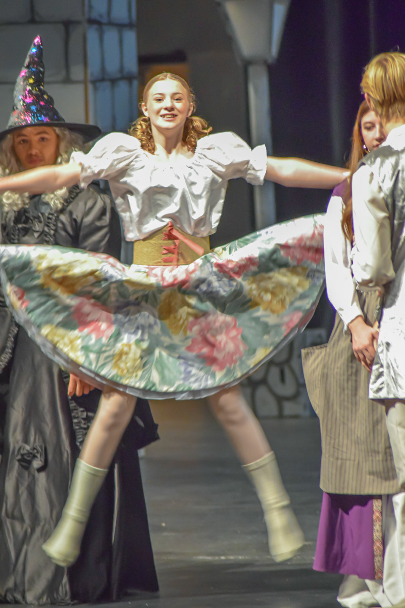 STAR POWER Emma Kellogg leaps into her role as Gretel with a star jump during the theater costume parade, showcasing her energy and enthusiasm for the stage. (Photo by Ollie Fox)