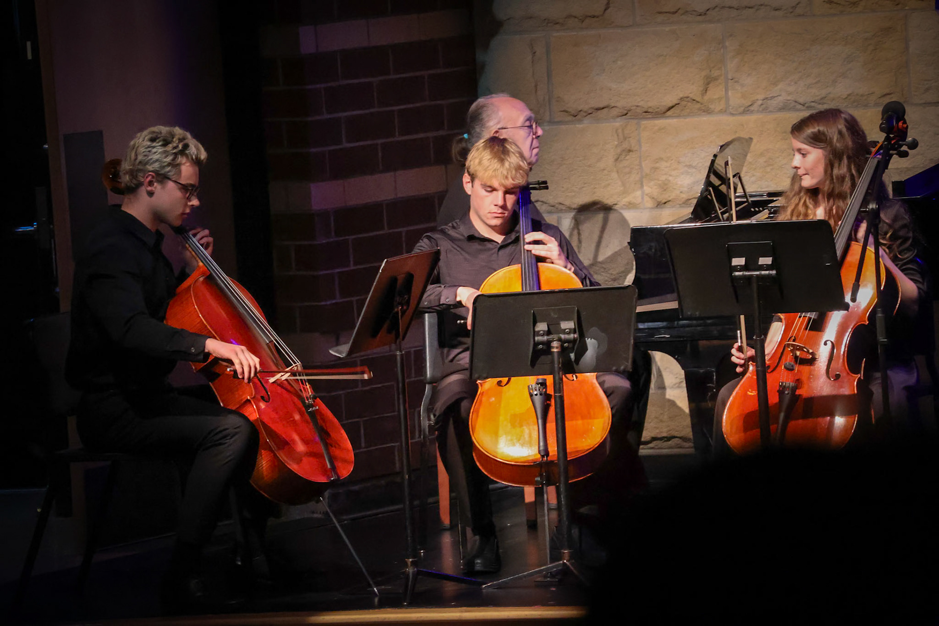 Seniors Ethan Snapper, Andrew Barnum, and Hannah Bennett get their cellos ready to collab in an amazing performance. (Photo by Sophia Myers)