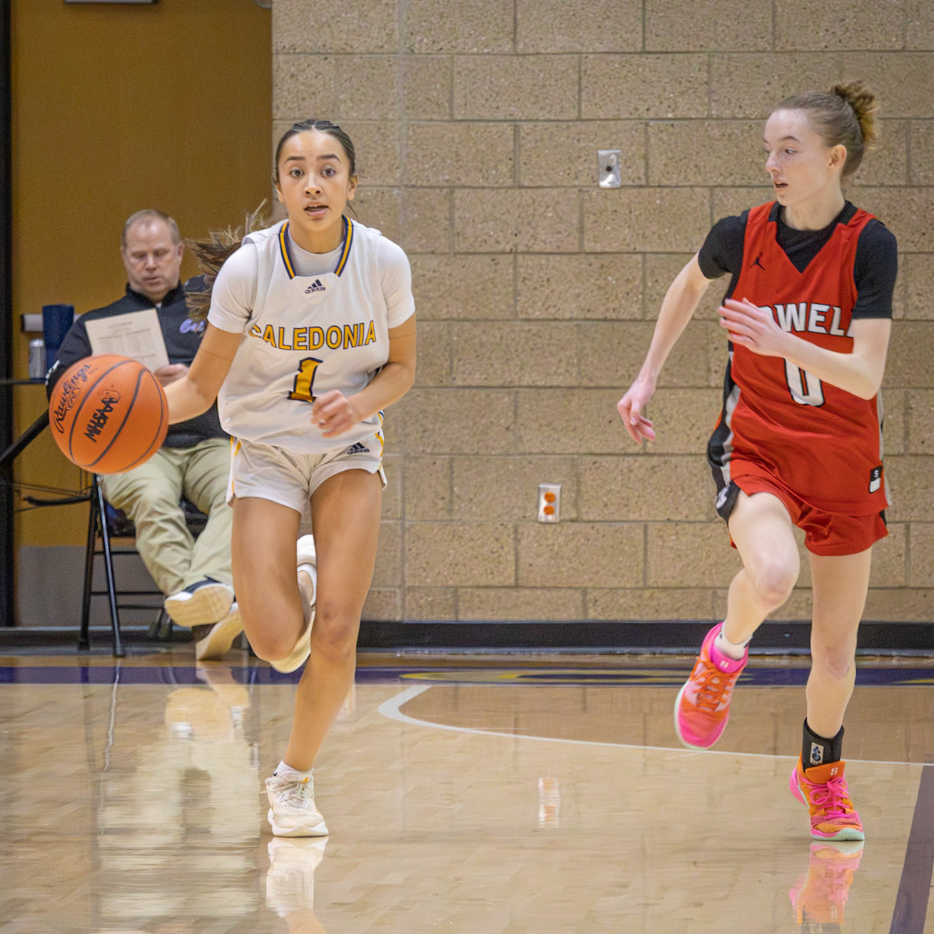 Braylee Tep pushes the ball up the court for the scots during fast break action. (Photo by Landry Mueller)
