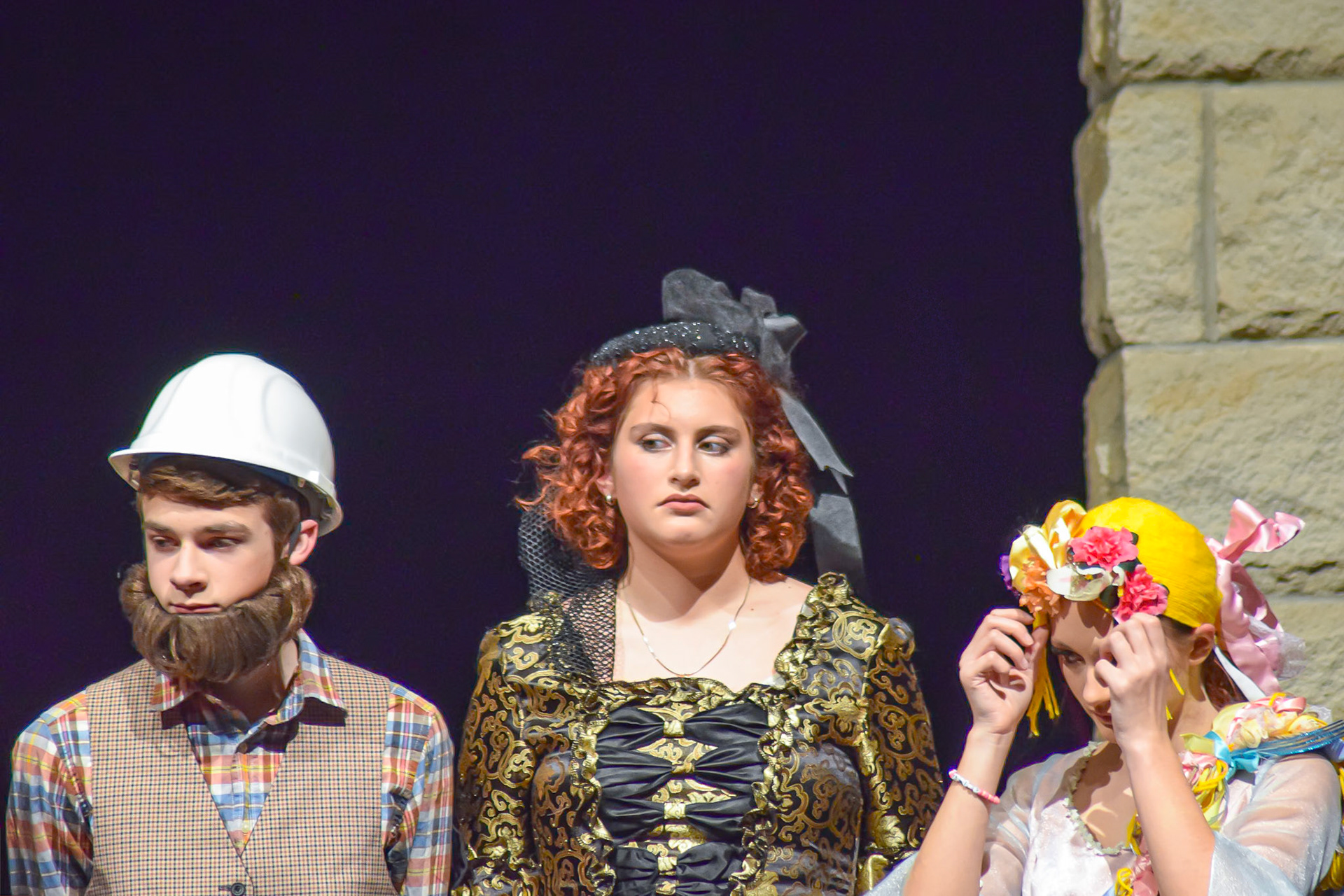 Braden Hofstee as Dwarf 1, Abigail Wilkes as the Enchantress, and Maggie Koopman as Rapunzel. (Photo by Ollie Fox)