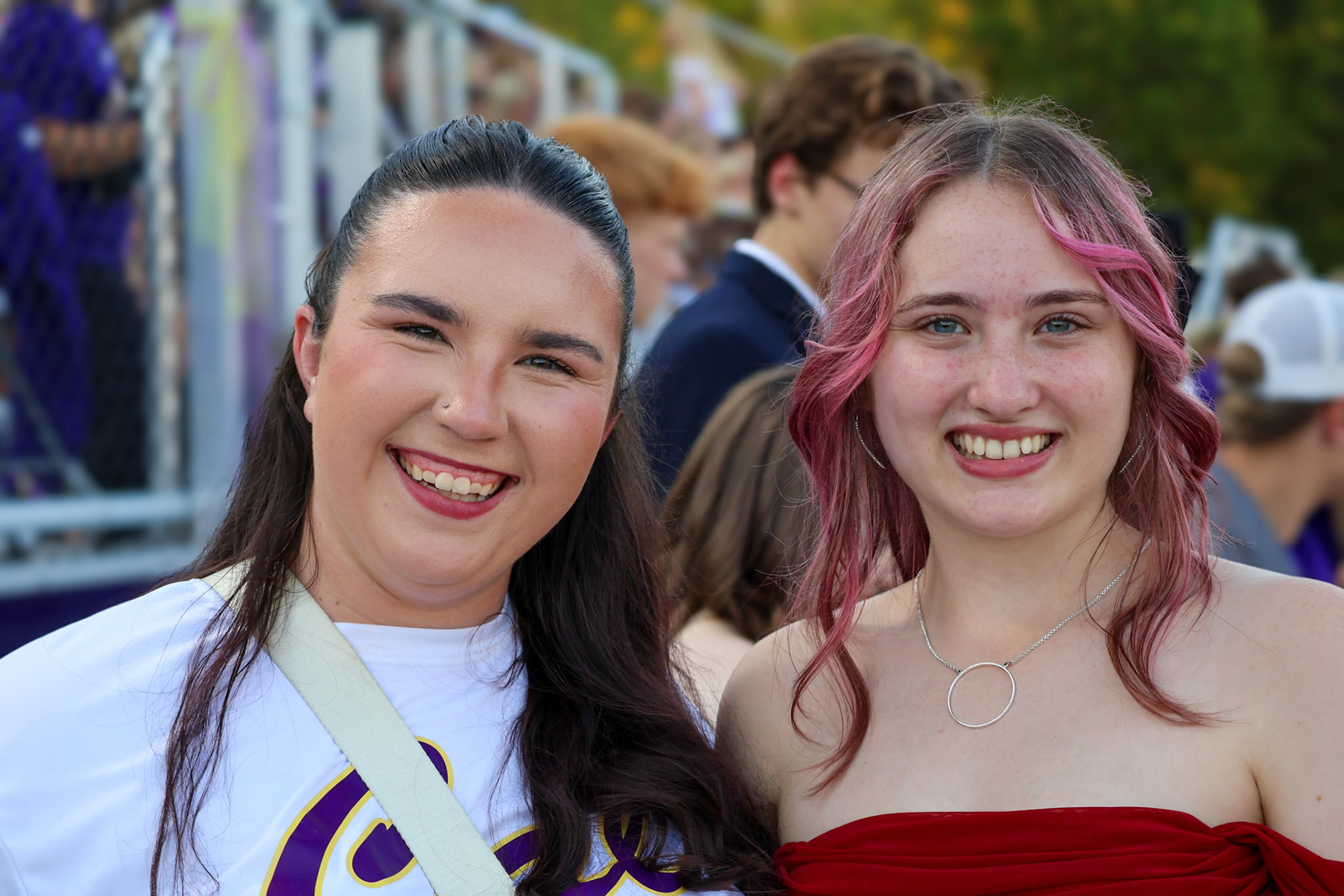 Seniors Marian Listen and Sophia Fata celebrate their last senior parade float ride.(Photo by Brianna Severson)