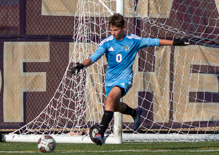 RESET AND RELEASE  Wesley Lloyd clears with purpose, turning defense into the first move of the attack. (Photo by Avery Hitsman)