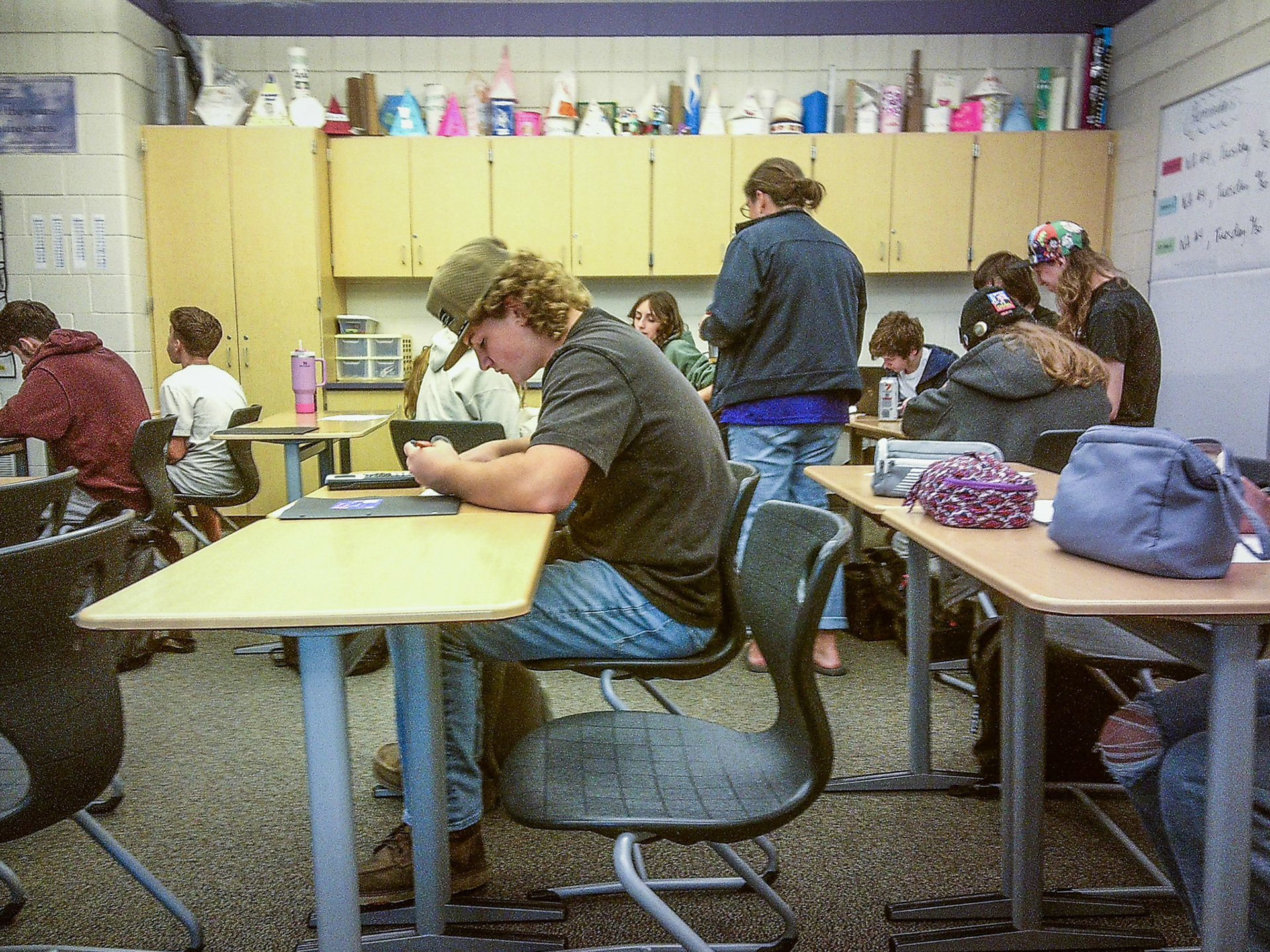 Jaxton Gyorki stays focused on the lesson during geometry class while others find their own rhythm. (Photo by Aslyn Crocker)