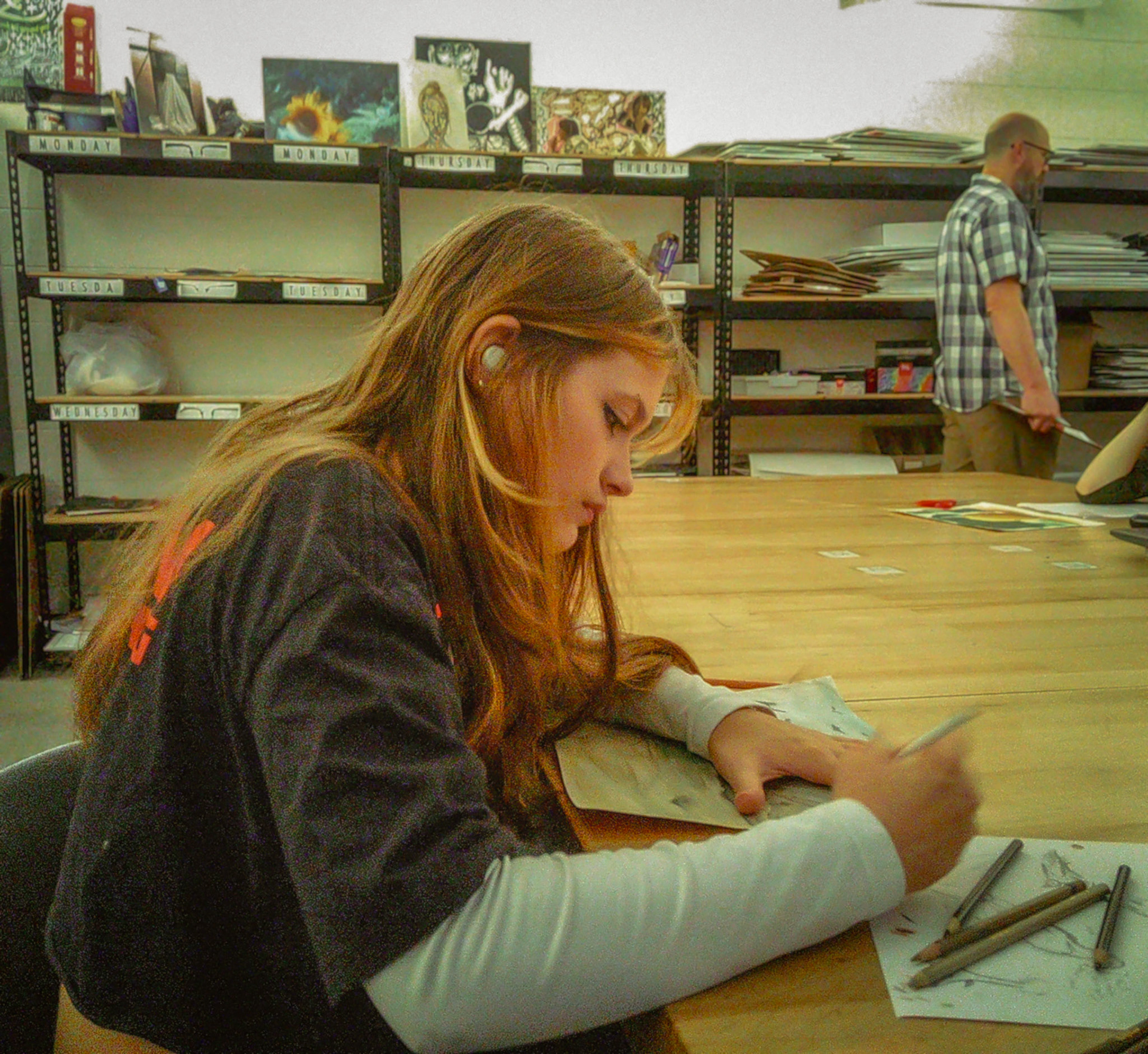 Sophia Price shades to bring depth and emphasis to her artwork in AP 2D Studio Art. (Photo by Molly Larson)