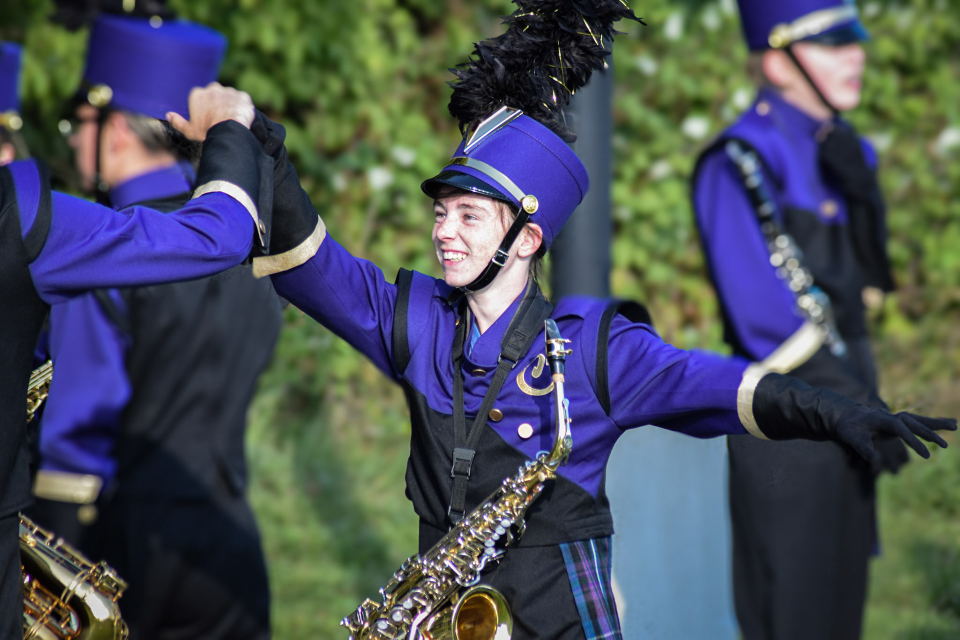 BAND BOOST  Senior Emma Horton gets a fistbump of encouragement before the game. (Photo by Ollie Fox)