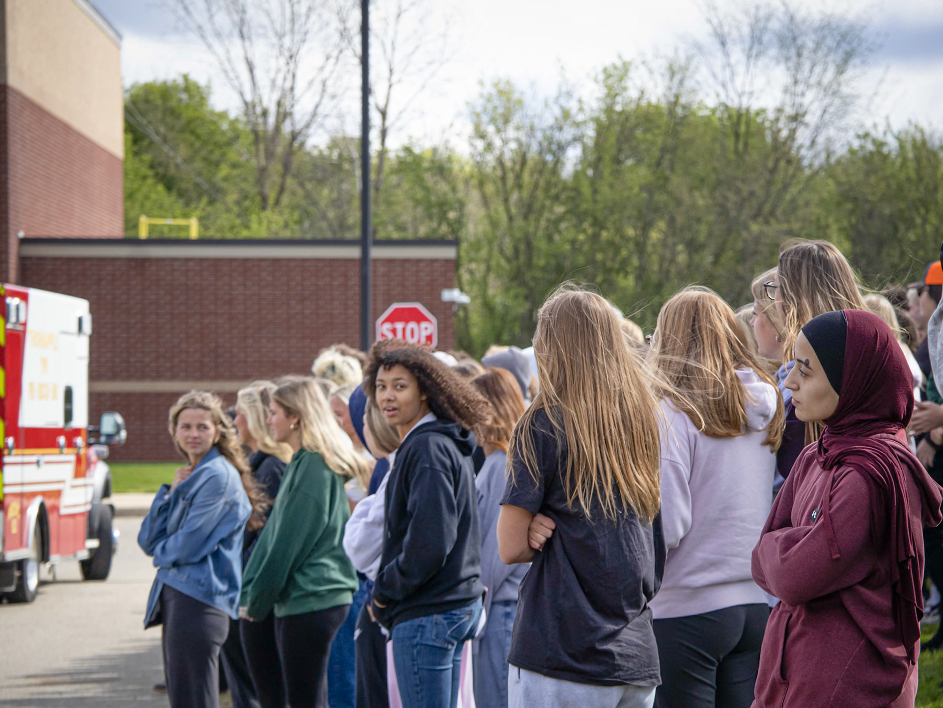 The helicopter’s powerful wind blows through the hair of students from Caledonia High School as they stand in the grass watching the staged crash demonstration during the Distracted Driving Assembly. (Photo by Ella-Grace Wickens)