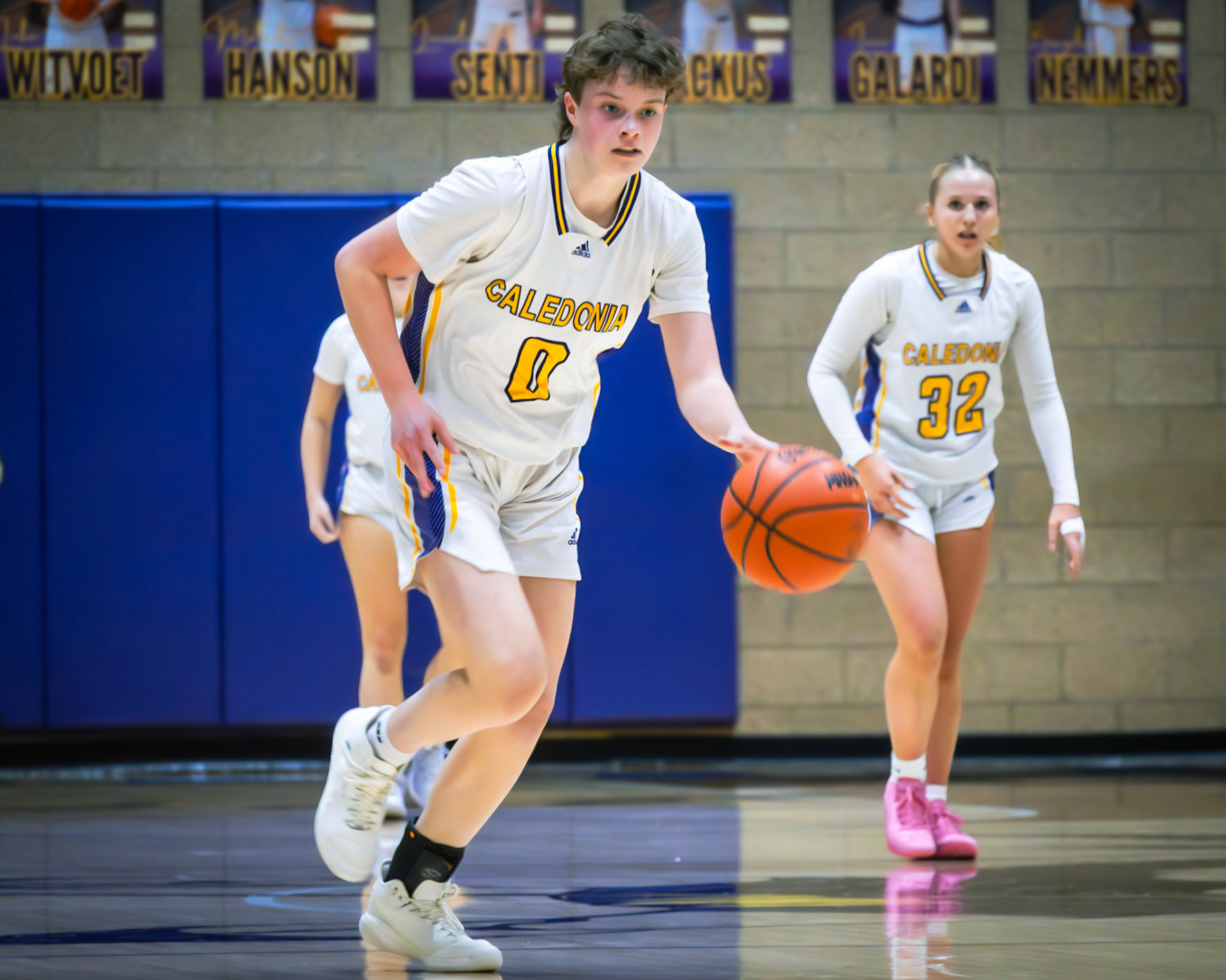 Lilli Ward pushes the pace, racing down the court for the layup. (Photo by Elise Clarin)
