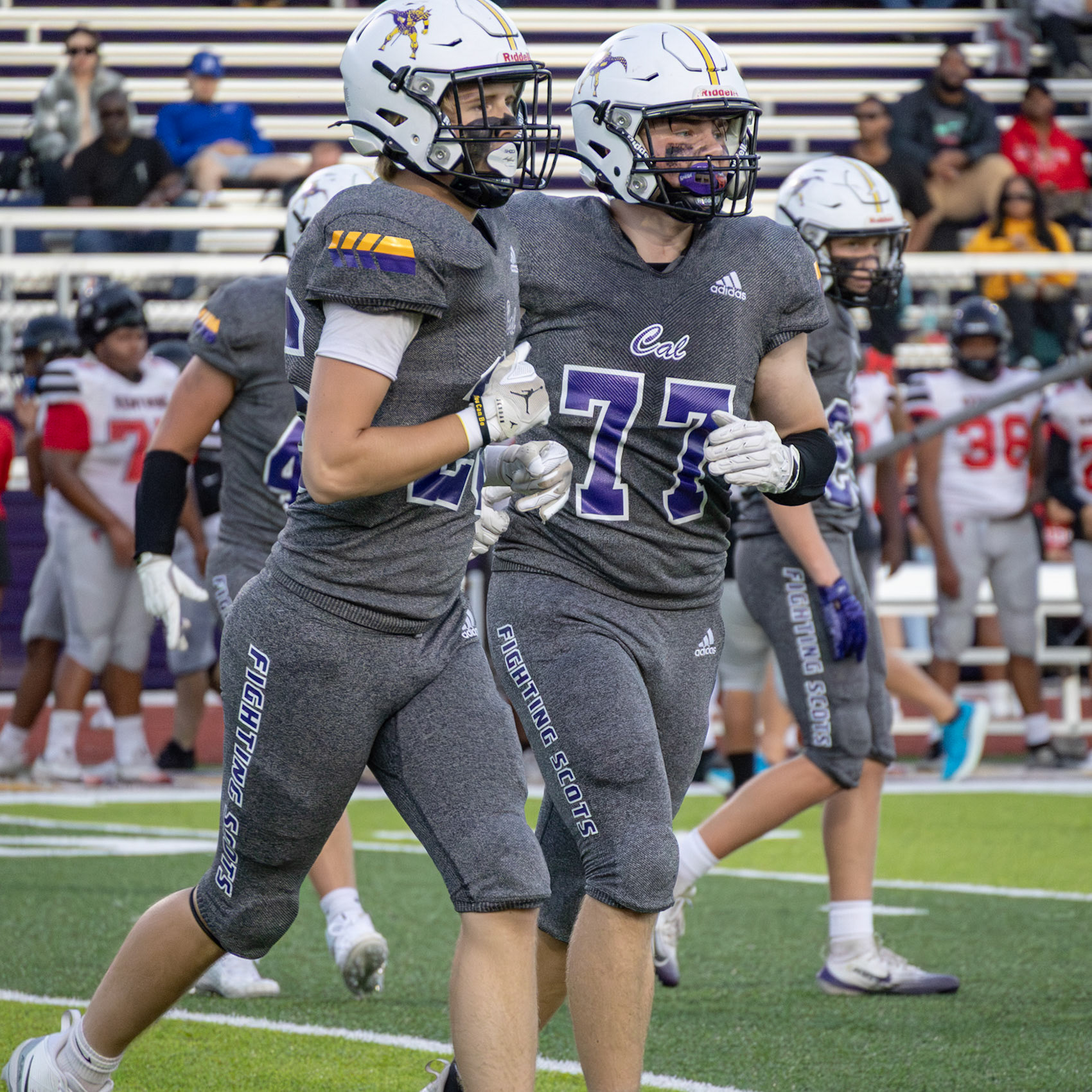 Jogging to the sideline Asher Munger and Miles Dood sprinting back to the sideline after a good play. (Photo by Ella-Grace Wickens)