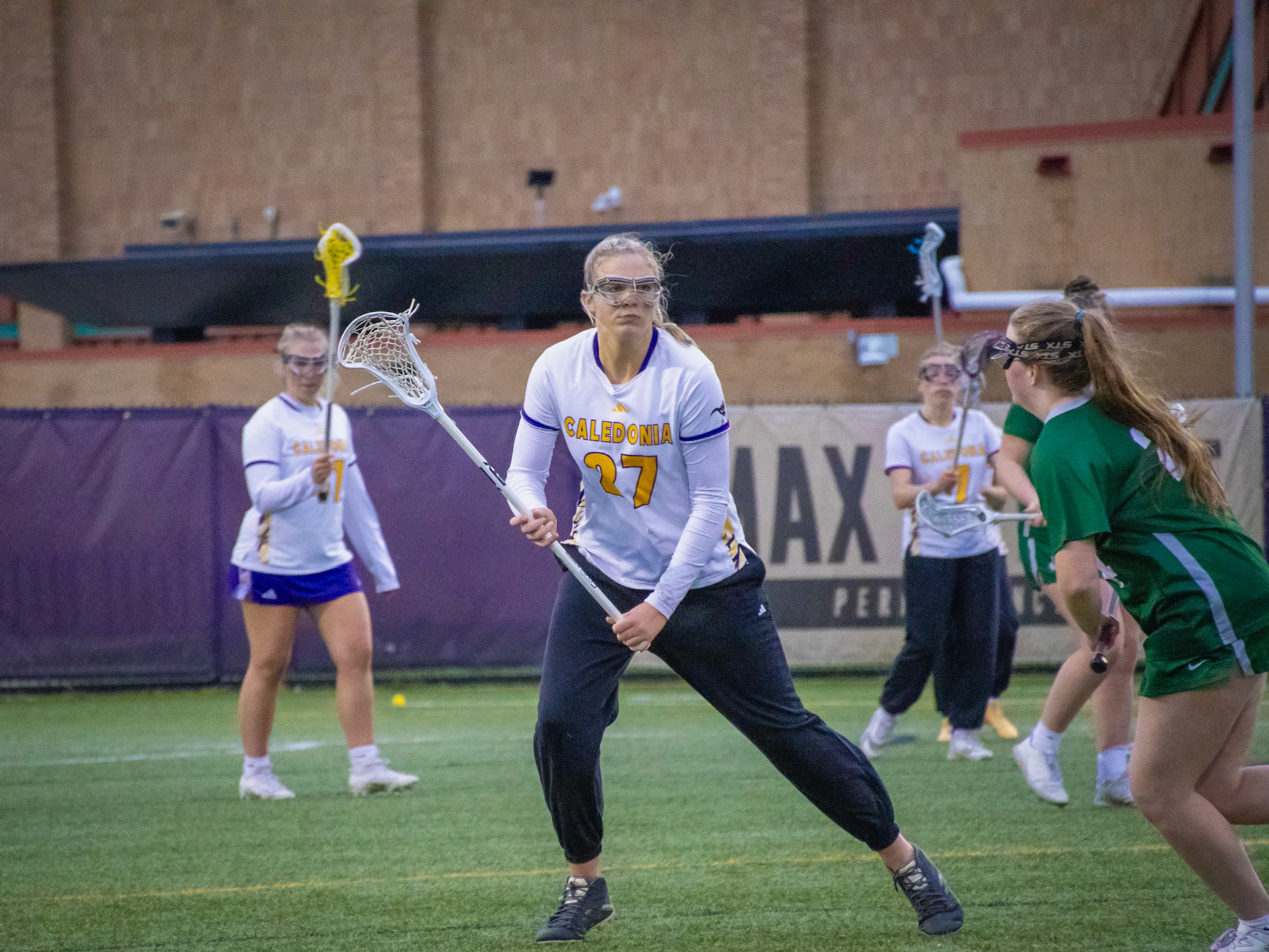 Staring at the opponents stick Mallory Graham keeps a close eye on her so she doesn't get past her and closer to the net. (Photo by Ella-Grace Wickens)