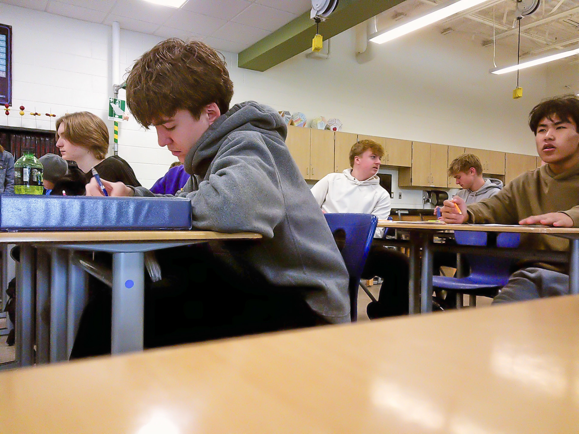 Jotting down notes, Steven Pekrul listens carefully while Victor Thawng is very intrigued by the new information he is learning. (Photo by Emma Garza)