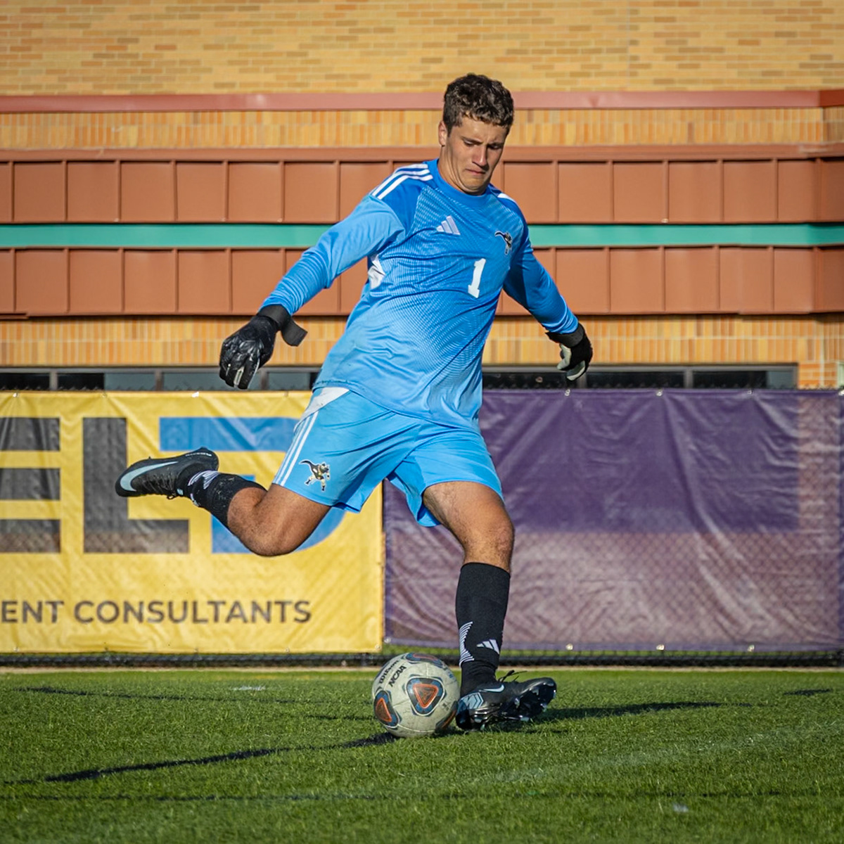 Focused and fearless, Nick Long lines up the perfect kick to send the ball back into play. (Photo by Akaela Daman)