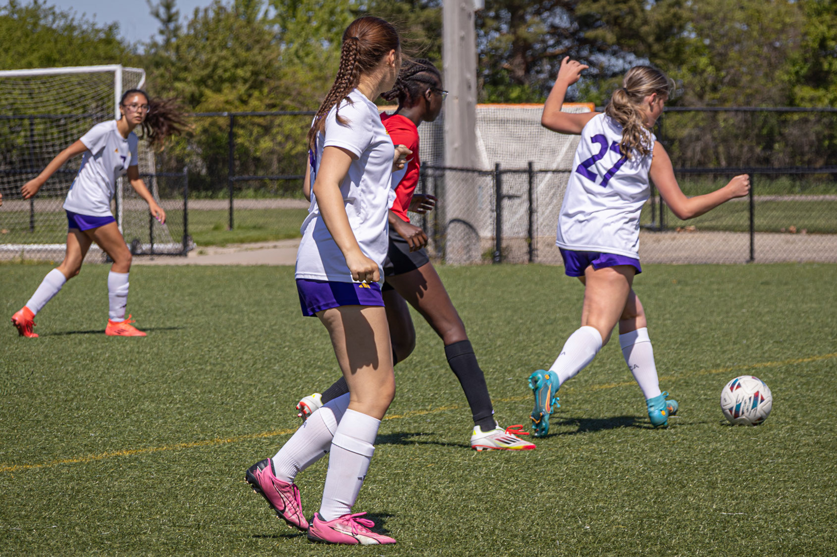 Freshman Reese Krieger is determined to stay in control of the ball, even with pressure from an opponent. (Photo by Eva Sierra)