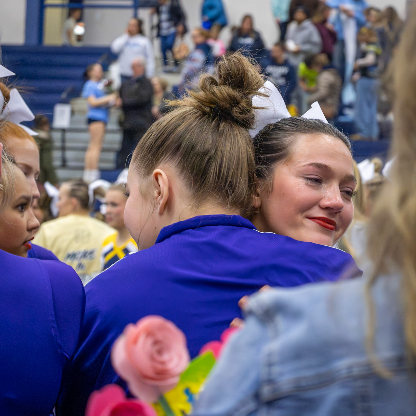 Tears and hugs mark Avery Helmholdt and Allison Dudicz’s last routine as teammates. (Photo by Lilli Jackson)