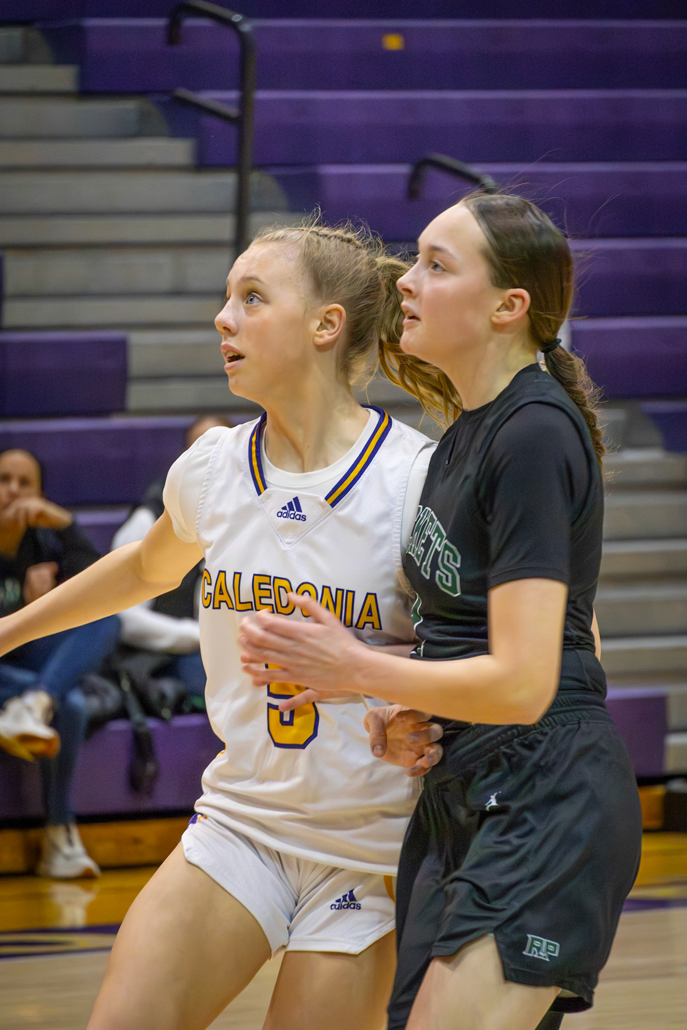Freshman Reese Abbott keeps her eyes on the ball, staying alert and holding her ground while guarding an opposing player. (Photo by Mackenzie Popma)