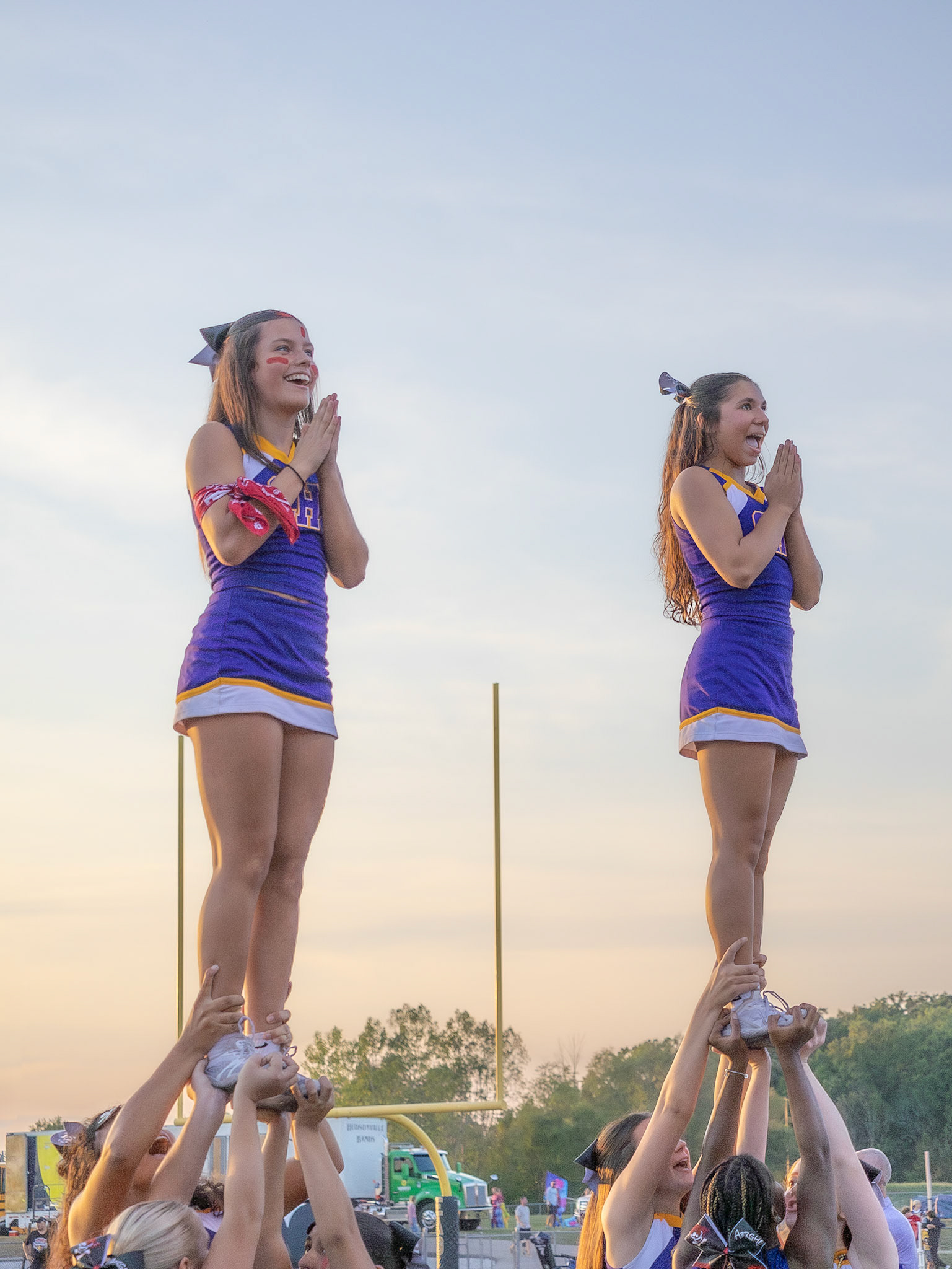 Adriana Twigg and Reagan Stevens beam with confidence as they hit their stunt, embodying true Caledonia spirit while we face Hudsonville. (Photo by Lillian Jackson)