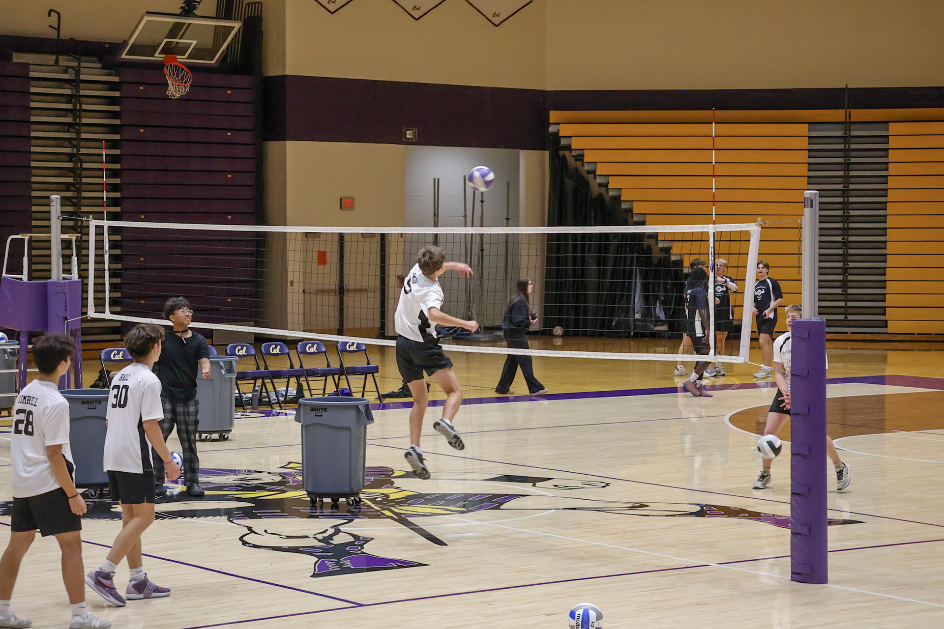 Lincoln Snow flys up for his practice spike before his game vs the seniors. (Photo by Abigail Tava)