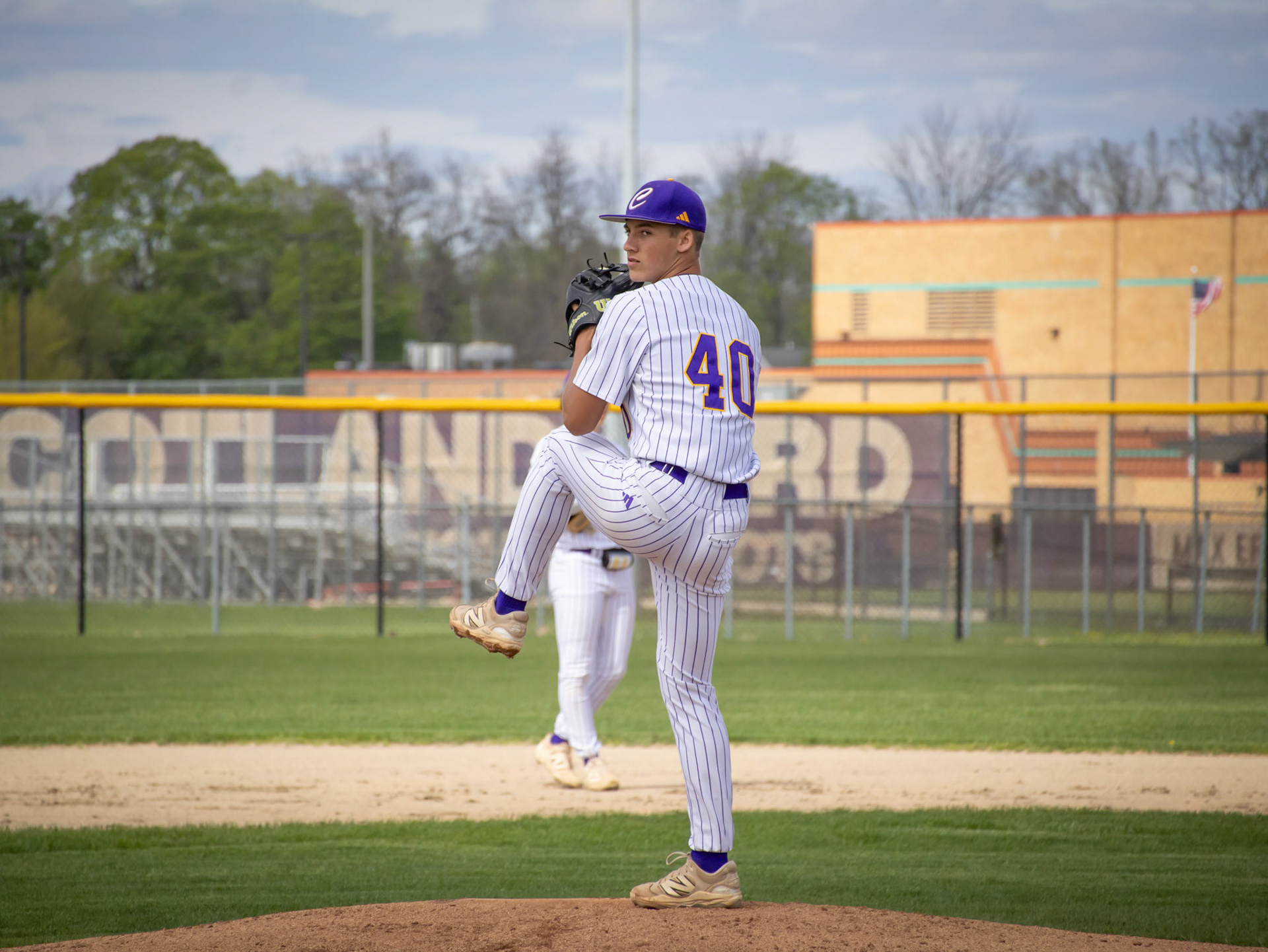 Moments before throwing his first pitch Bryce Johnson winds up before throwing a slider. (Photo by Ella-Grace Wickens)