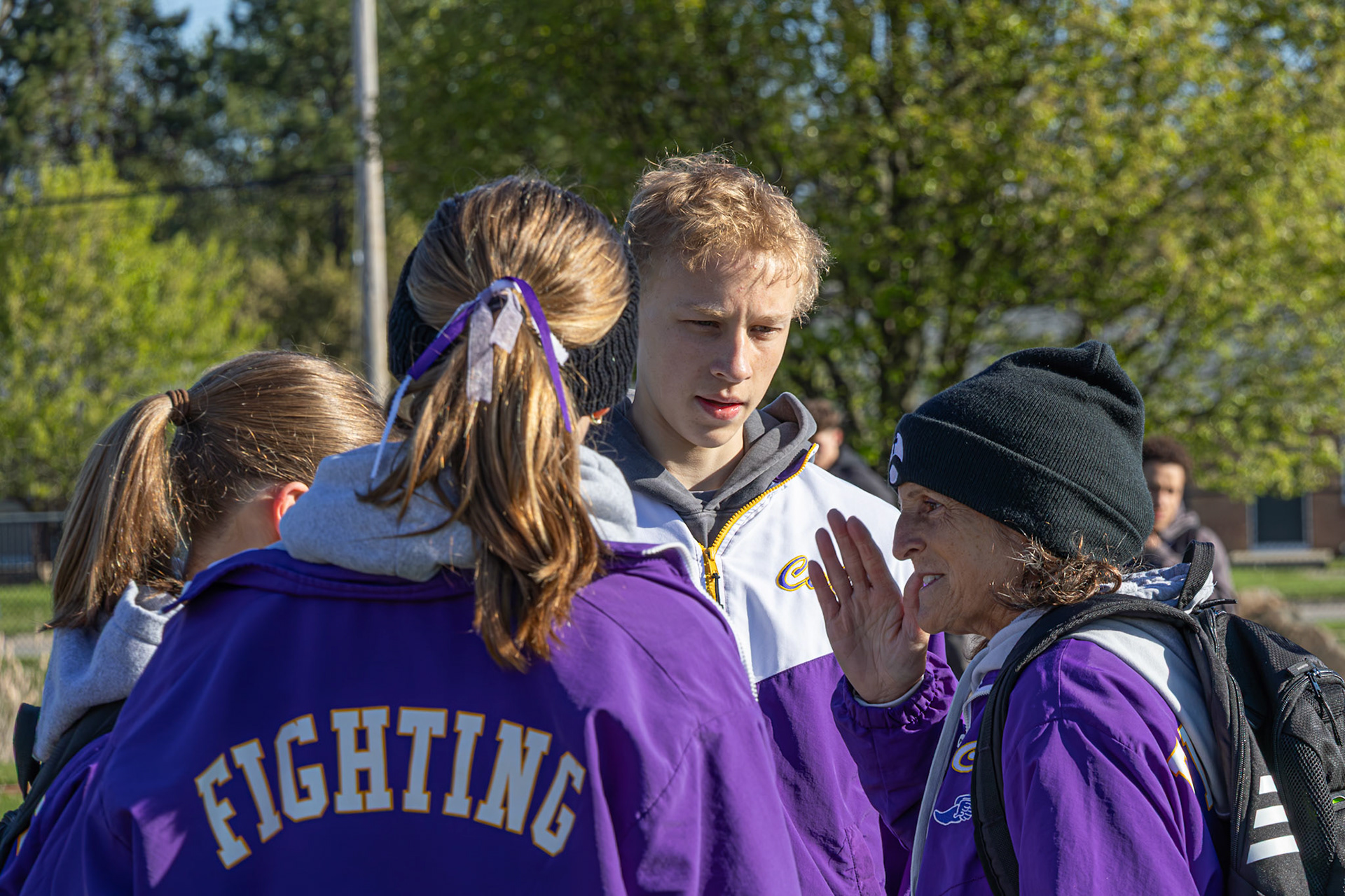 High jumper Cohen Bloem gets a pep talk before taking flight. (Photo by Mya VanderZwaag)